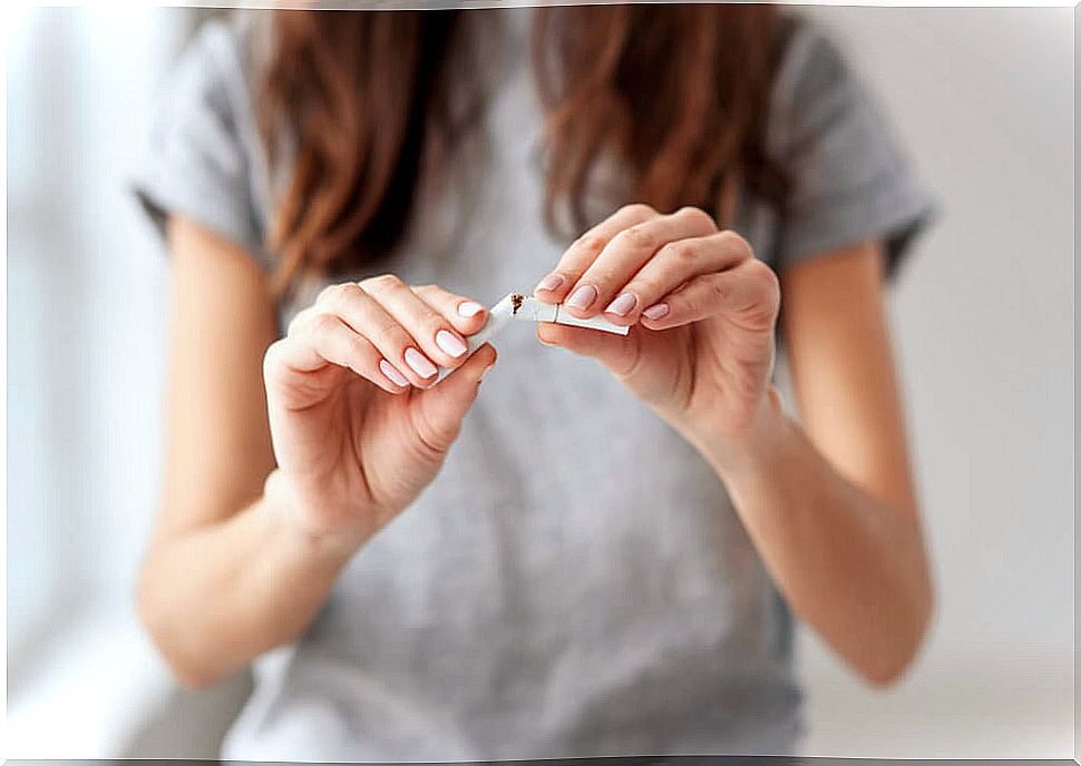 Woman breaking a cigarette