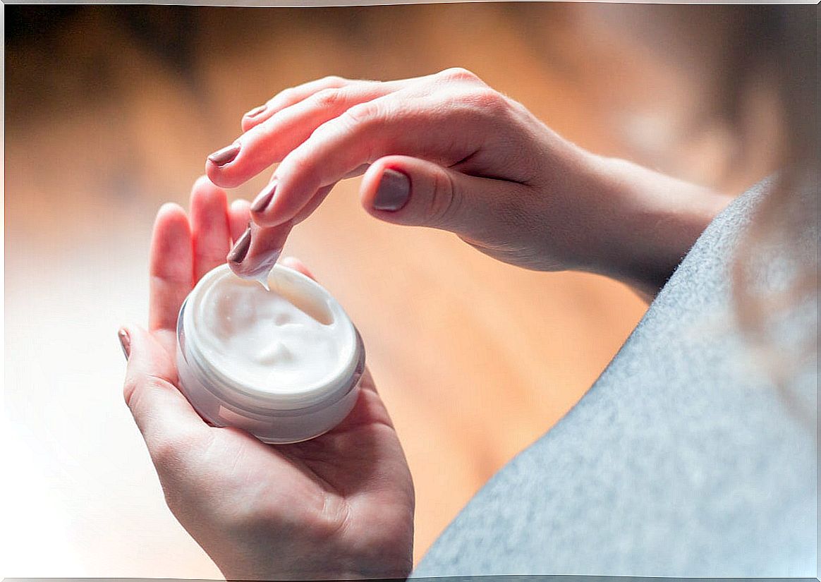 Woman with hand cream.