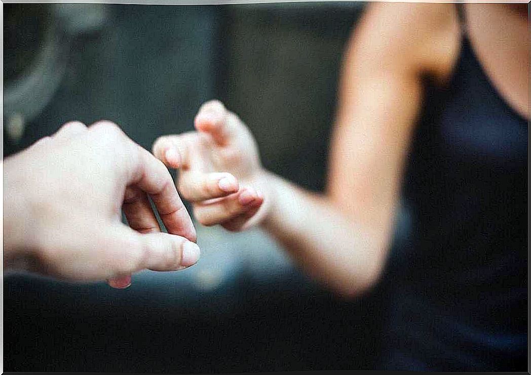 hands touching symbolizing when one helps others