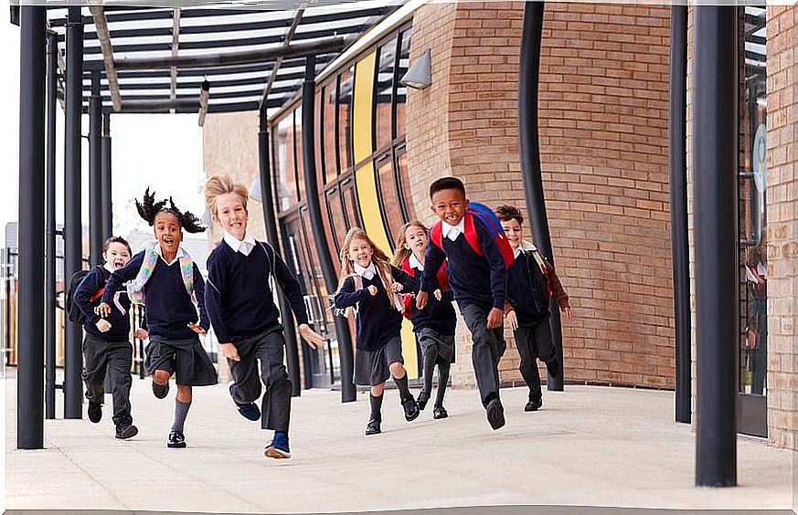 Children running out of school