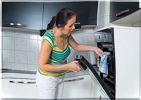 Woman cooking in the oven