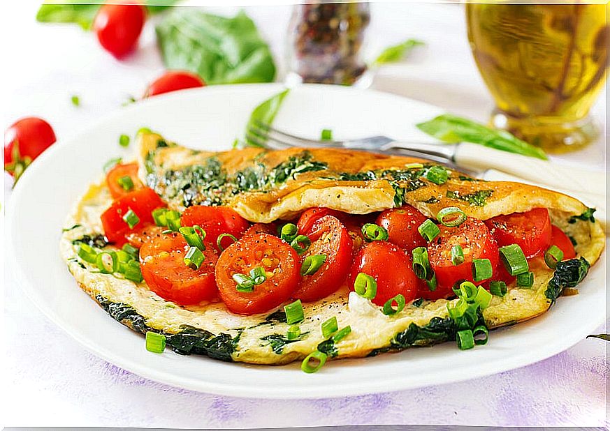 Omelette stuffed with tomatoes. 