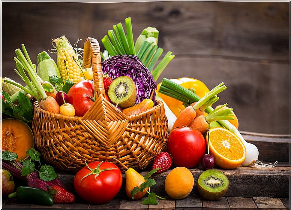 Basket full of healthy foods like vegetables and fruits